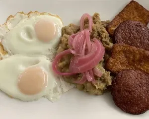 Traditional Mangu With Fried Dominican Cheese And Salami And Eggs Any Style