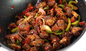 PEPPERED PORK WITH NIGERIAN FRIED RICE